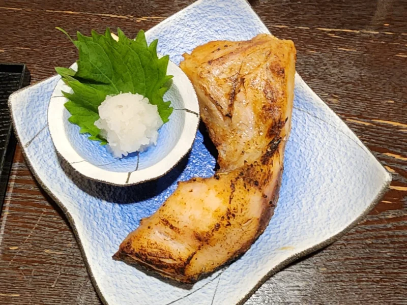 Grilled salmon collar at the izikia